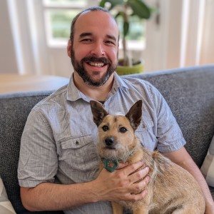 Dr. Bartley Harrison holding his dog