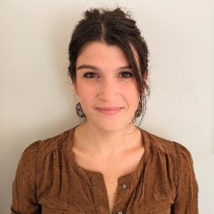 girl with brown hair wearing brown top